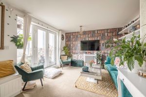 Living room + Balcony- click for photo gallery